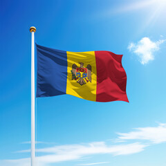 Waving flag of Moldova on flagpole with sky background.