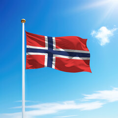 Waving flag of Norway on flagpole with sky background.