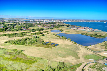 Fototapeta na wymiar Aerial photo over Gilkicker Lagoon and Gosport and Stokes Bay Golf Course towards the naval town of Portsmouth.