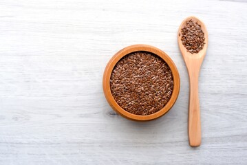 
Flax seeds in a wooden plate