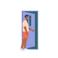 Young happy smiling man character standing at opened door holding doorknob vector illustration