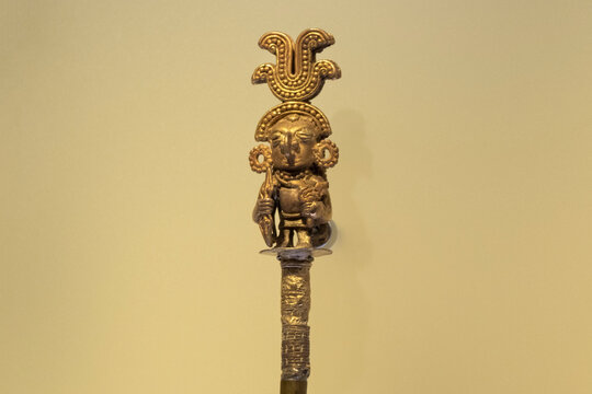 BOGOTA, COLOMBIA Closeup to a golden figure of a cacique at the top of a stick 