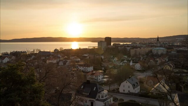 Summertime Golden Morning sun over Swedish Town Jonkoping, Great Lake Vattern and in the distance Husqvarna, Sweden.