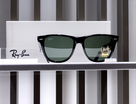Berlin, Germany - December 21, 2021: Rayban sunglasses in a store window display. Ray-Ban is a brand of sunglasses and eyeglasses founded in 1937 by the American company Bausch & Lomb in 1999