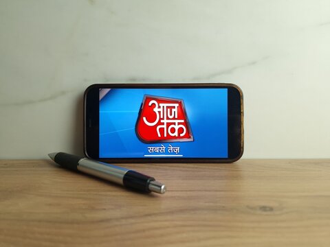 Konskie, Poland - June 24, 2023: Aaj Tak Hindi news channel logo displayed on mobile phone screen