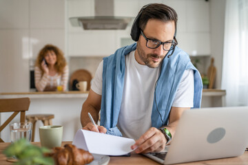 One man caucasian male freelancer work from home on laptop computer