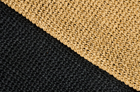Seamless knitted pattern from black and beige yarn. Hand knitted.