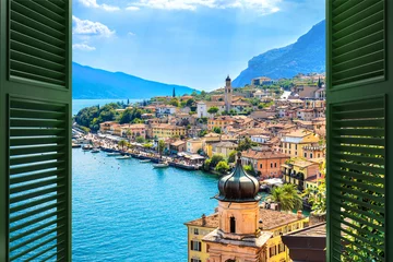 Wall murals Mediterranean Europe Window overlooking the village Limone Sul Garda on Garda Lake. The most famous tourist destination on lake. Lombardy, Italy.