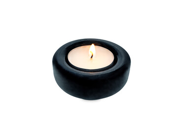 Burning candle on a white isolated background