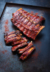 Barbecue veal spare loin ribs St Louis cut with hot honey chili sauce served as top view on a...