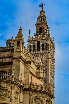 27.05.2023, Seville, Spain:'Cathedral de Sevilla' picture from the street. The cathedral, is open to public, you can see beautiful gothic style architecture unusually bright of the sunny weather
