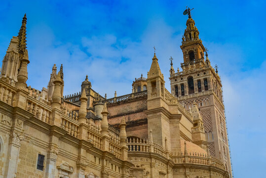 27.05.2023, Seville, Spain:'Cathedral de Sevilla' picture from the street. The cathedral, is open to public, you can see beautiful gothic style architecture unusually bright of the sunny weather
