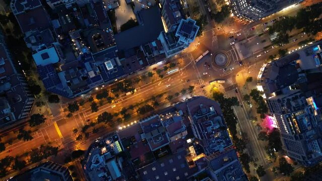 Central areas of Barcelona at night. Top view, filming from a drone.