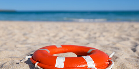 Sea lifebuoy and swimming pool with beach and swimming pool behind. Safety concept for bathers. Safety at sea and on vacation. Lifesaver. Ai generative.