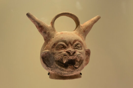 BOGOTA, COLOMBIA - Closeup to a zoomorphic ceramic ancient indigenous vase inside colombian golden museum