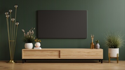 Mockup a cabinet TV wall mounted on dark green wooden slatted wall background. - obrazy, fototapety, plakaty