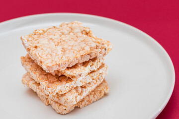 A Stack of Square Rice Cakes on White Plate. Dietary Crispbread