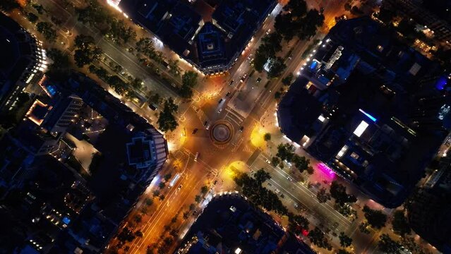Central areas of Barcelona at night. Top view, filming from a drone.