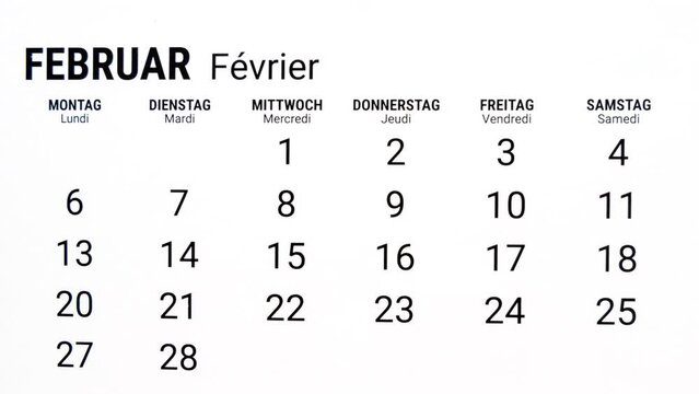 Time lapse zoom out motion of calendar month of February in german and french