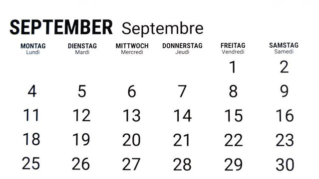 Time lapse zoom out motion of calendar month of September in german and french
