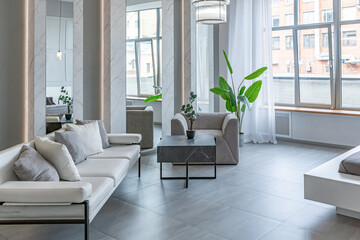 stylish bright modern bedroom interior with decorative niches with LED lighting and a huge...