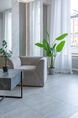 stylish bright modern bedroom interior with decorative niches with LED lighting and a huge panoramic window in gray and white colors and geometric shapes