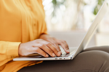 Closeup of business woman, freelancer, copywriter hands typing on keyboard working online, planning...