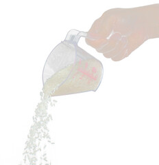 Japanese Rice fall, white grain rices pouring down abstract cloud fly from measuring Cup. Beautiful complete seed rice in air, food object design. Selective focus freeze shot Black background isolated