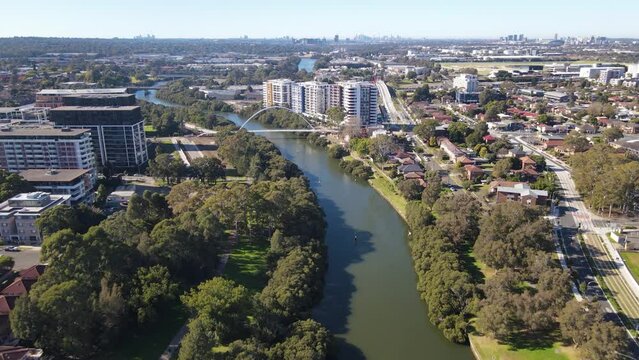 Aerial drone view above Parramatta River in Greater Western Sydney, NSW, Australia looking in the east direction    