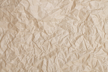 A crumpled piece of kraft paper