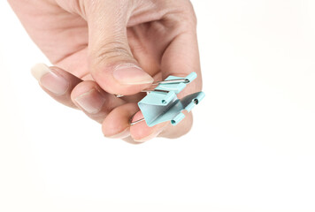 Holding the open clip in one hand