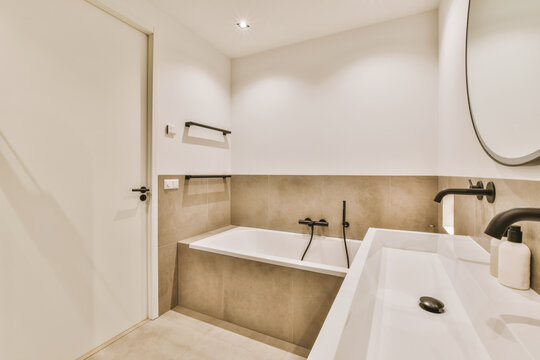 a modern bathroom with two sinks and a large mirror on the wall in the background is an open shower stall