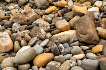 Pile of Colorful pebbles and rocks on the beach