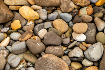 Closeup of a pile of Colorful Pebbles on the beach