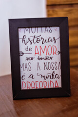 a wooden framed plaque with words of love written on it