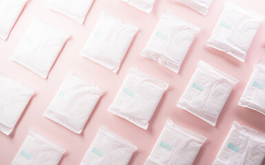 Fototapeta na wymiar White sanitary pad on pastel background. Woman health or body positive concept.