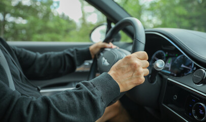 car hand wheel, symbolizing control, navigation, and the driver's connection to the road. Represents power, freedom, and the journey ahead