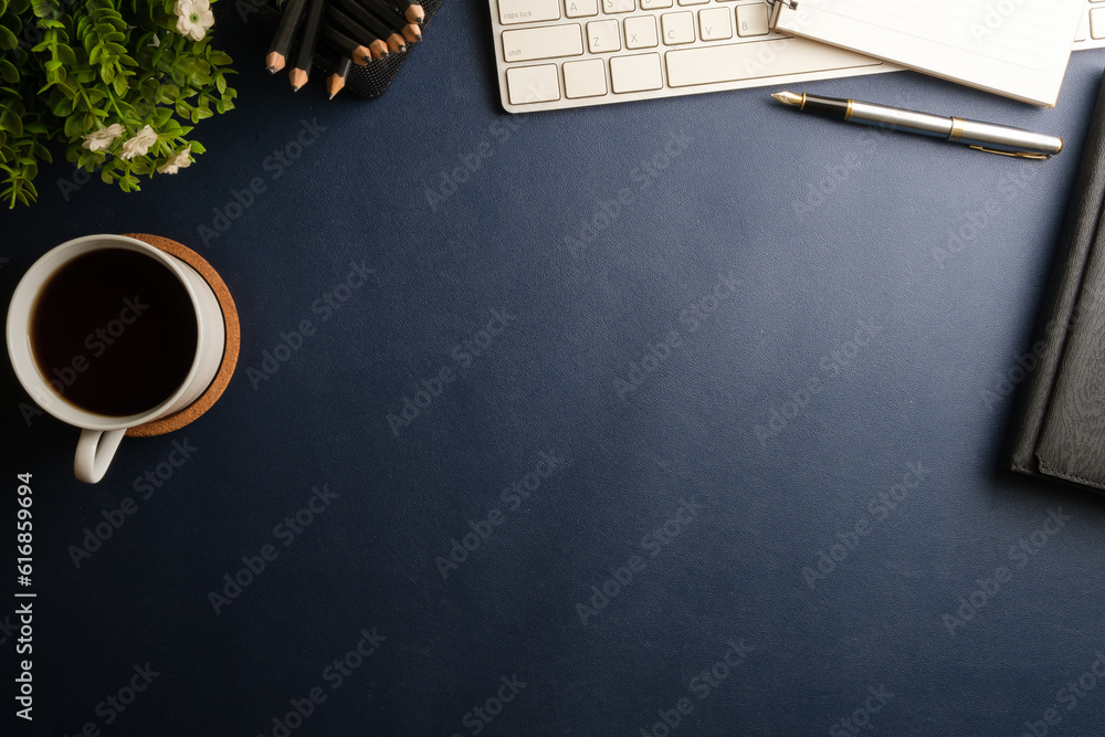 Poster office desk with wireless keyboard, coffee cup and notepad. top view with copy space for your text.