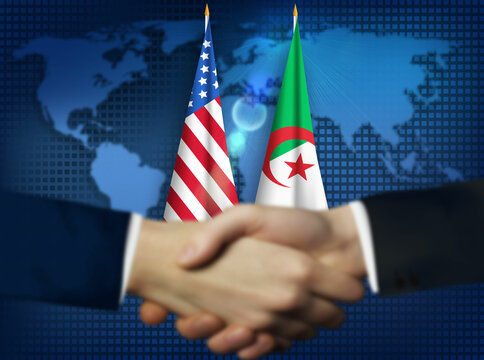 Two person shaking hands in front American,Algeria flags.Algeria,US bilateral relation concept background