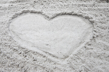 Fototapeta na wymiar heart shaped sandy beach outline calm soothing sand beach background with copy space