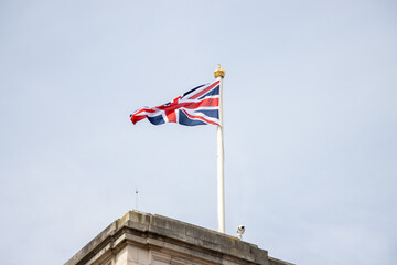 Fototapeta na wymiar The flag of the UK above Buckingham Palace 