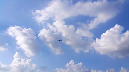 An airplane silhouette and clear blue sky