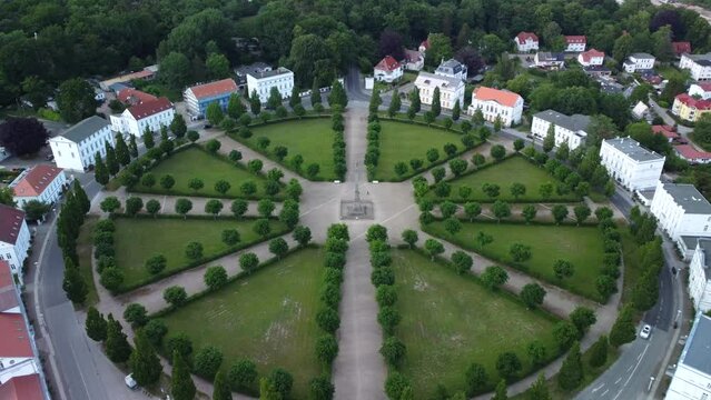Incoming drone shot of the historical classic circus square of Putbus Town with white houses, located on the R&uuml;gen Island in Germany