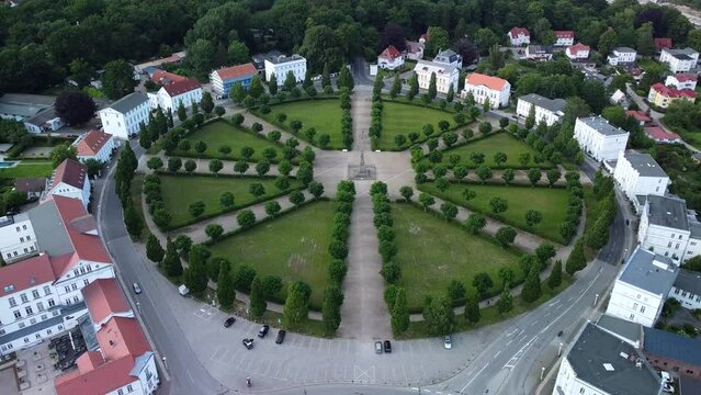 Drone shot, showing the historical classic circus square of Putbus town with white houses, located on the R&uuml;gen Island in Germany
