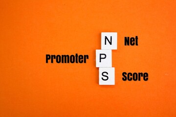 letters of the alphabet NPS as NET PROMOTER SCORE. Business development concept. business or...