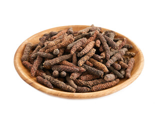 long pepper or piper longum in wood plate isolated on white background. heap of long pepper or piper longum isolated. long pepper, piper longum                               