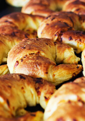 Bakery, croissant and bread in a store with coffee shop food and product in a kitchen. Fresh, closeup and French pastry with patisserie and dessert in a cafe with flour and wheat for a snack