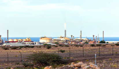 Desalination plant on the seashore in the city of Sur. Sultanate of Oman - obrazy, fototapety, plakaty