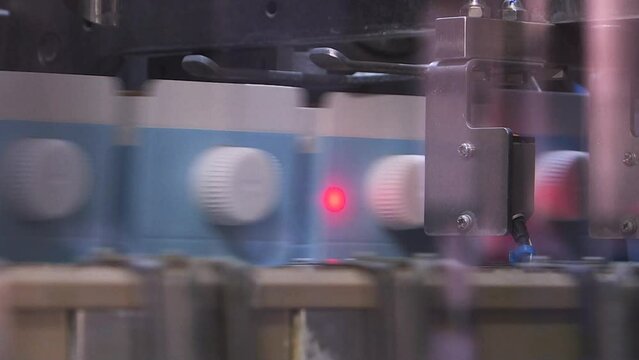 A line of dairy products. Packages of dairy products are moved along a conveyor line at the factory. Production conveyor belt at the dairy plant.