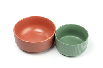 ceramic bowl terra cotta colour and green bowl empty isolated on white 